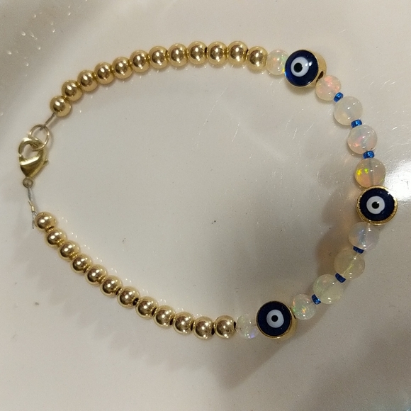 The evil protection eye 24 k gold and Ethiopian welo opal bracelet - Picture 6 of 8